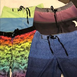 4 Pairs of Hurley board shorts.  Size 12.